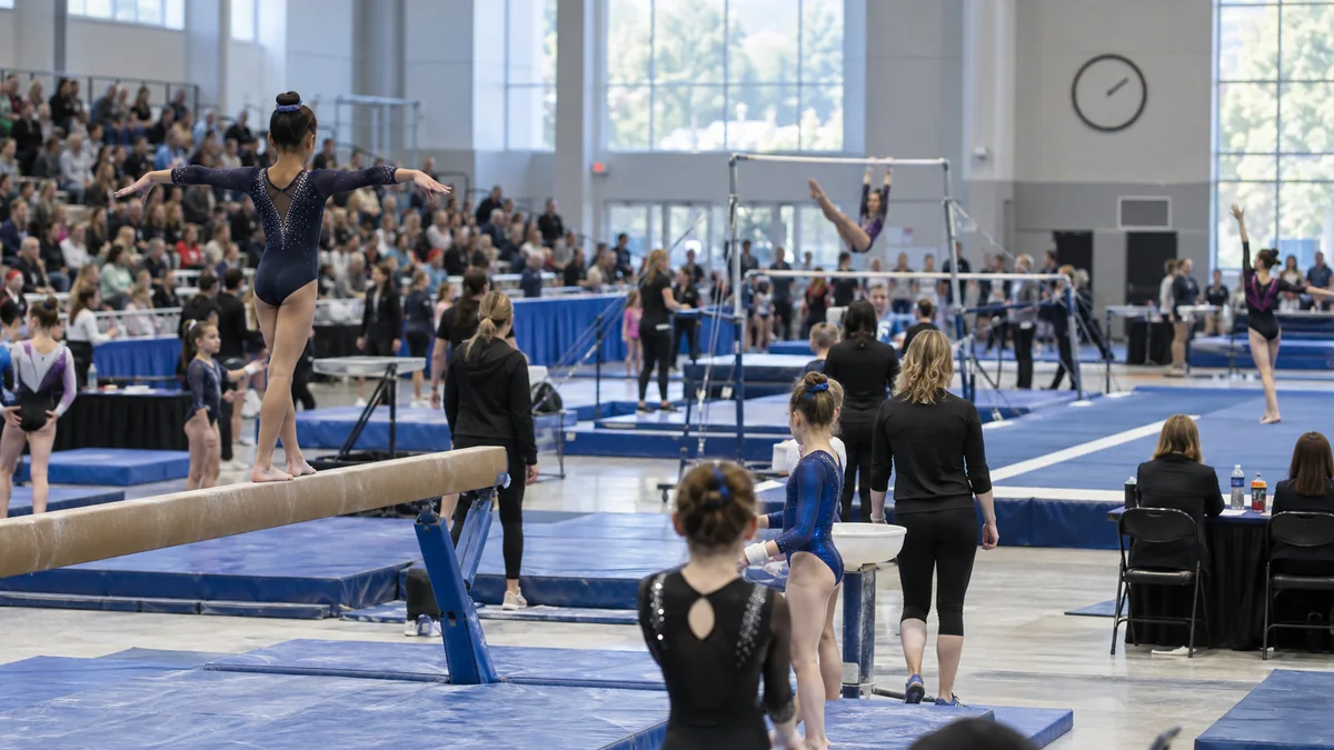 Gymnastics meet in progress inside an arena